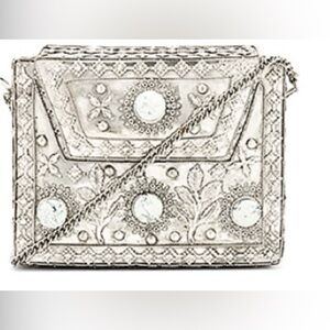 From St Xavier silver clutch bag
